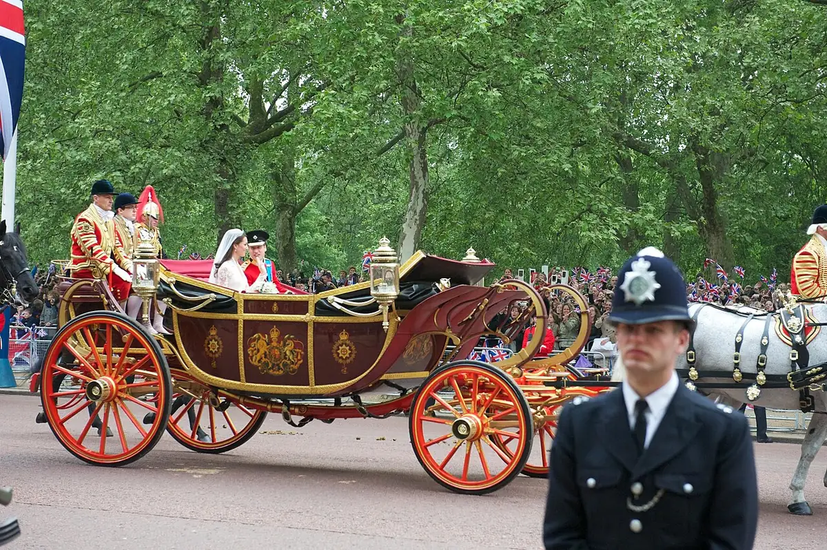 The newly married couple ride in the 1902 State Landau from Westminster Abbey to Buckingham Palace, April 29, 2011.